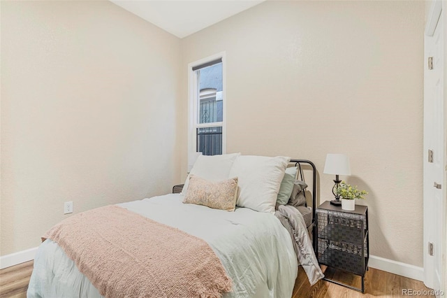 bedroom with light hardwood / wood-style flooring