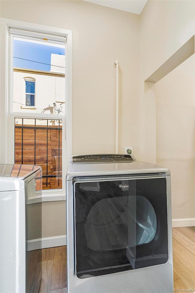 laundry room with light wood-type flooring