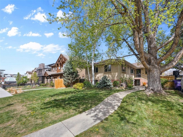 746 Birch St, Denver, CO 80220 - view of front of house with fence, a residential view, and a front lawn