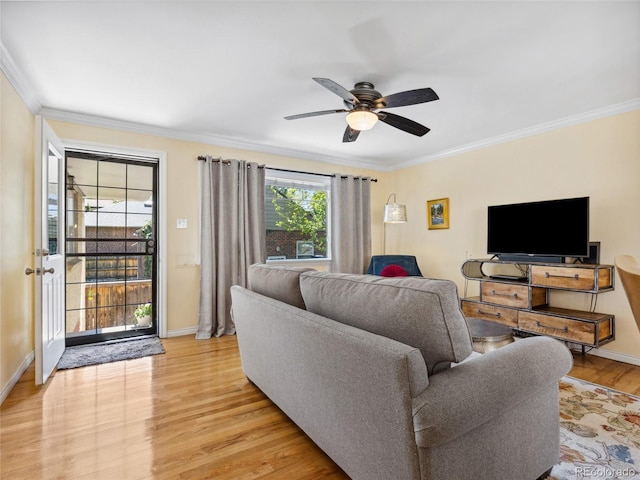 746 Birch St, Denver, CO 80220 - living room featuring light wood-style floors, baseboards, ornamental molding, and ceiling fan