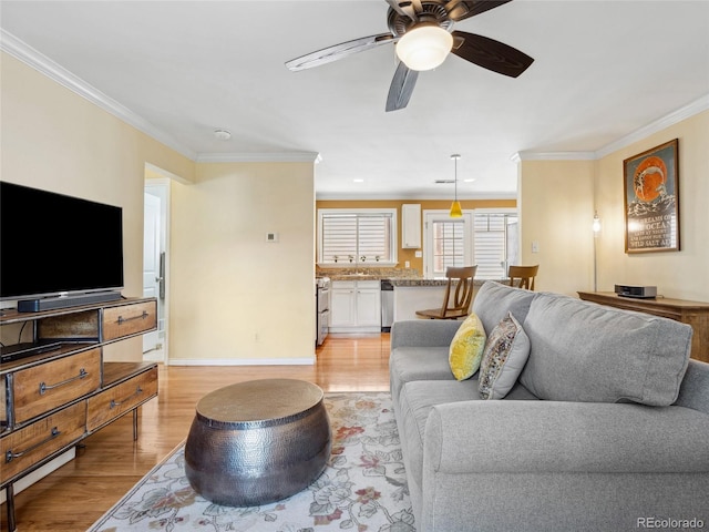 746 Birch St, Denver, CO 80220 - living room with light wood-style floors, baseboards, crown molding, and ceiling fan