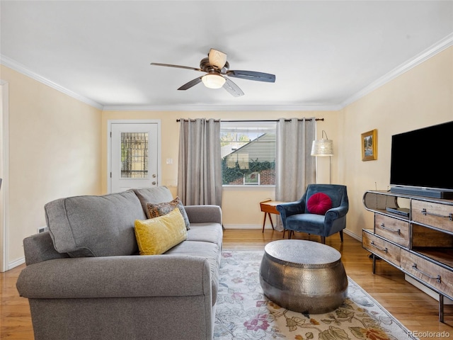 746 Birch St, Denver, CO 80220 - living room featuring ceiling fan, baseboards, ornamental molding, and wood finished floors