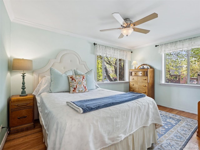 746 Birch St, Denver, CO 80220 - bedroom featuring crown molding, a ceiling fan, baseboards, and wood finished floors
