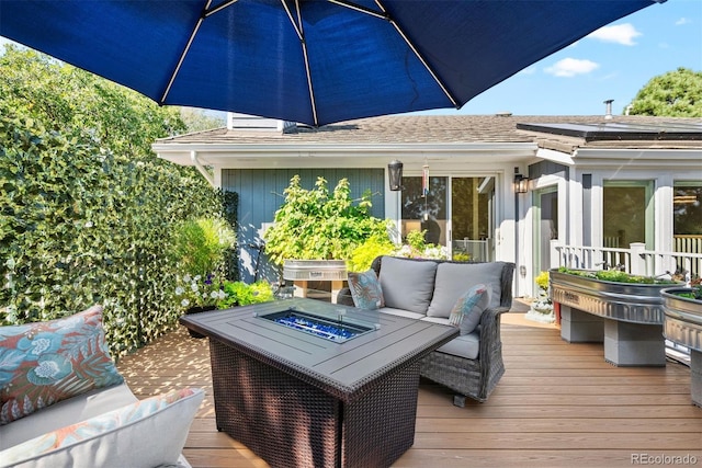 wooden terrace featuring outdoor lounge area