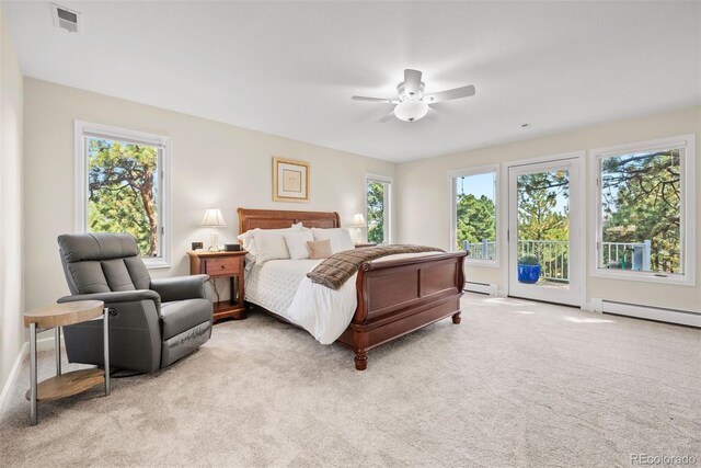 carpeted bedroom with access to outside, a baseboard heating unit, and ceiling fan