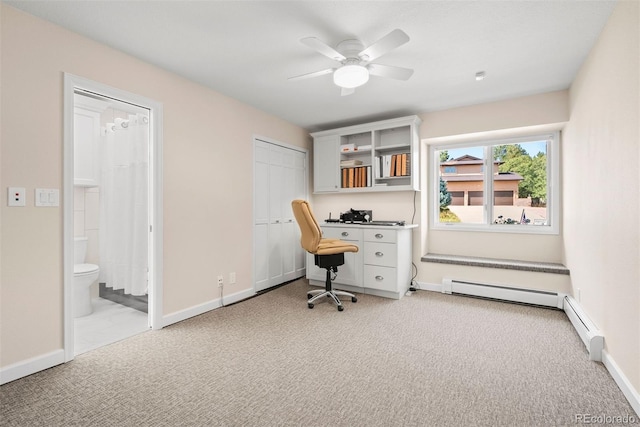 office space with ceiling fan, built in desk, and light colored carpet