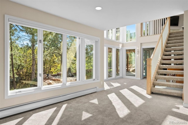 unfurnished sunroom with a baseboard radiator