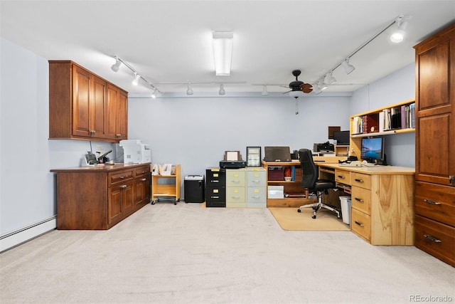 office featuring light carpet, track lighting, a baseboard heating unit, and ceiling fan