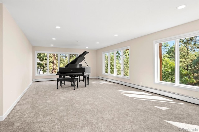 misc room featuring a healthy amount of sunlight and a baseboard radiator