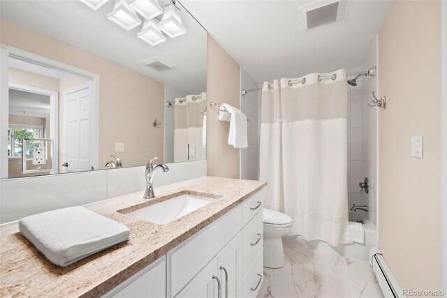 full bathroom featuring vanity, baseboard heating, shower / bath combo with shower curtain, and toilet