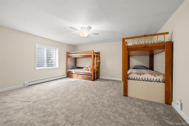 unfurnished bedroom with ceiling fan, a baseboard radiator, and carpet flooring