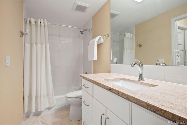 full bathroom featuring vanity, shower / bath combo with shower curtain, and toilet