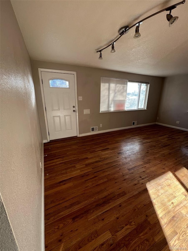 1245 Yates St, Denver, CO 80204 - entrance foyer featuring rail lighting and dark wood-style flooring