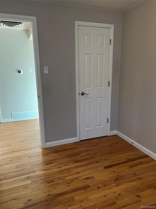 1245 Yates St, Denver, CO 80204 - unfurnished room with wood finished floors and baseboards