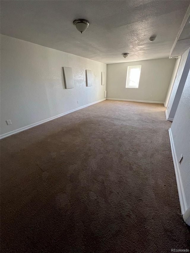 1245 Yates St, Denver, CO 80204 - carpeted empty room with baseboards and a textured ceiling