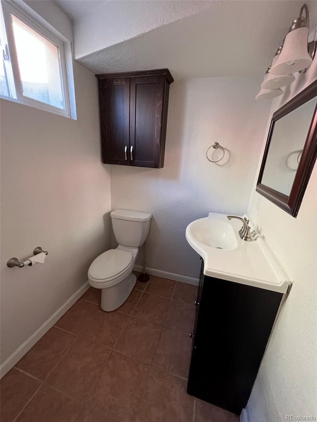 1245 Yates St, Denver, CO 80204 - half bathroom with vanity and tile patterned floors