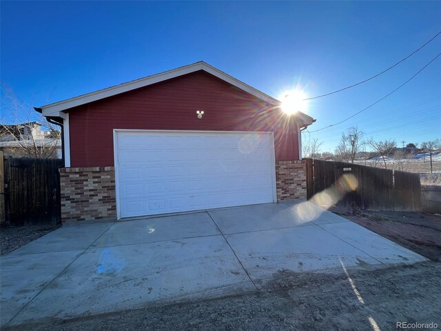 1245 Yates St, Denver, CO 80204 - garage with concrete driveway