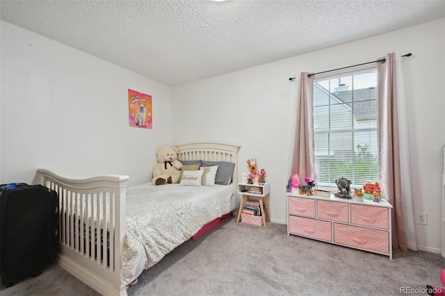 carpeted bedroom featuring a textured ceiling