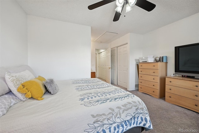 bedroom featuring ceiling fan, carpet, a textured ceiling, and a closet