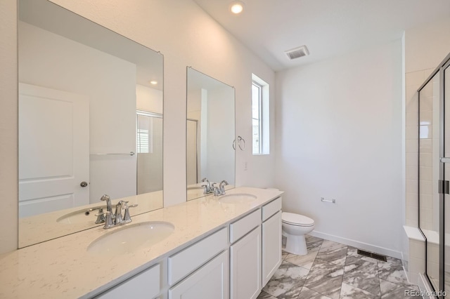 708 N Bently St, Watkins, CO 80137 - full bath with a shower with door, toilet, marble finish flooring, double vanity, and baseboards
