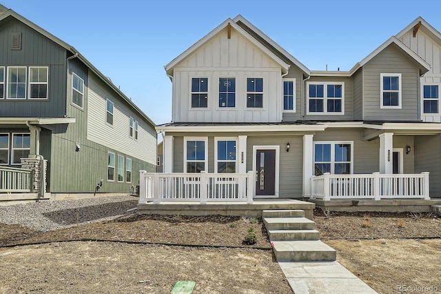 708 N Bently St, Watkins, CO 80137 - view of front of home with a porch and board and batten siding