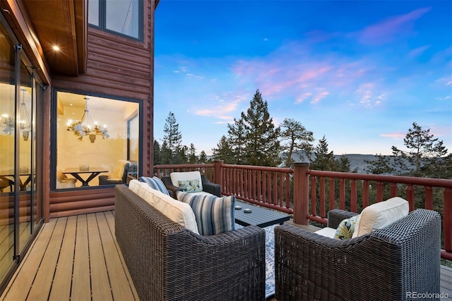 wooden terrace featuring outdoor lounge area