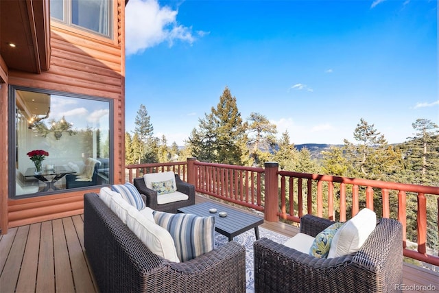 wooden deck featuring an outdoor living space