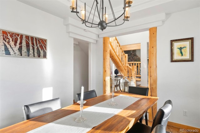 dining space with baseboards and stairs