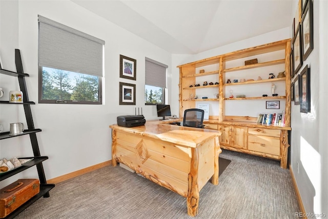 office with carpet, vaulted ceiling, and baseboards