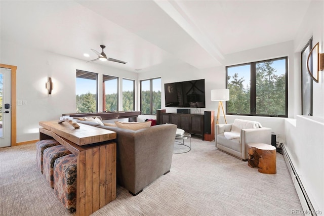 living area featuring light carpet, ceiling fan, a baseboard radiator, and baseboards