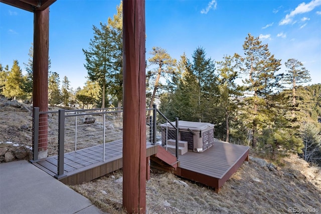 wooden terrace with a hot tub