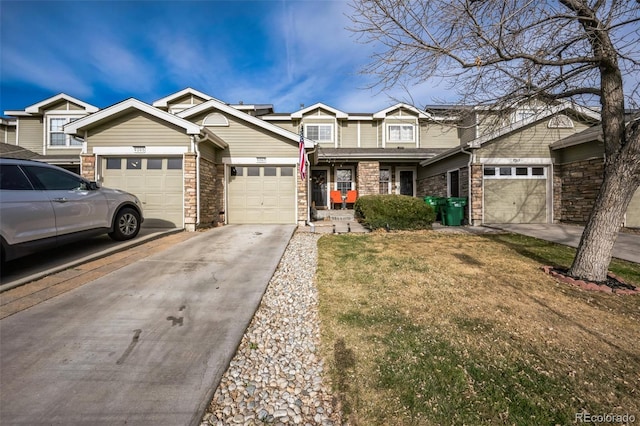 townhome / multi-family property featuring an attached garage and driveway