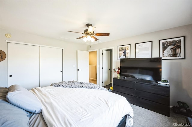 bedroom with a ceiling fan, a closet, and carpet floors