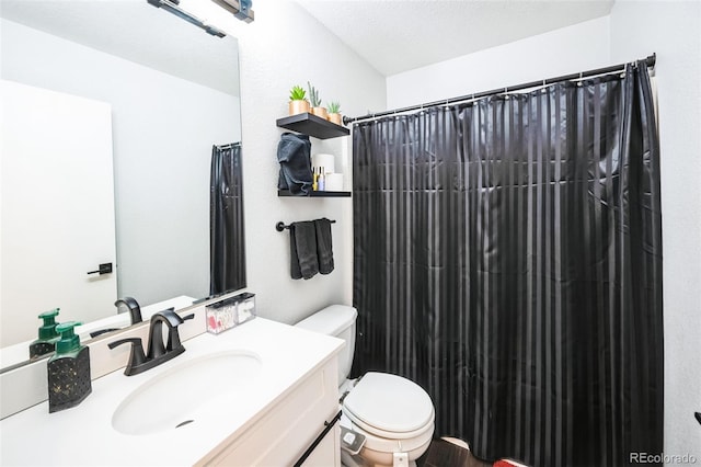 bathroom featuring curtained shower, toilet, and vanity