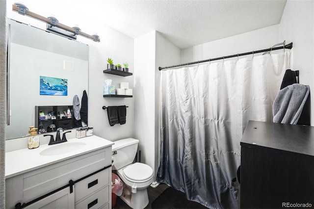 full bath with curtained shower, a textured ceiling, toilet, and vanity