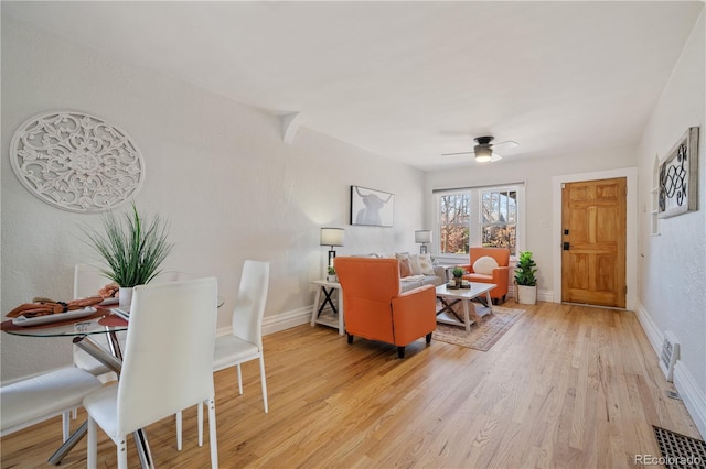 living room with hardwood / wood-style floors and ceiling fan