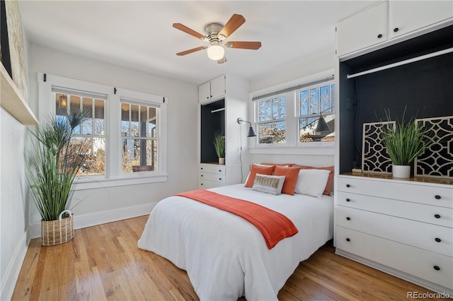 bedroom featuring light hardwood / wood-style flooring and ceiling fan