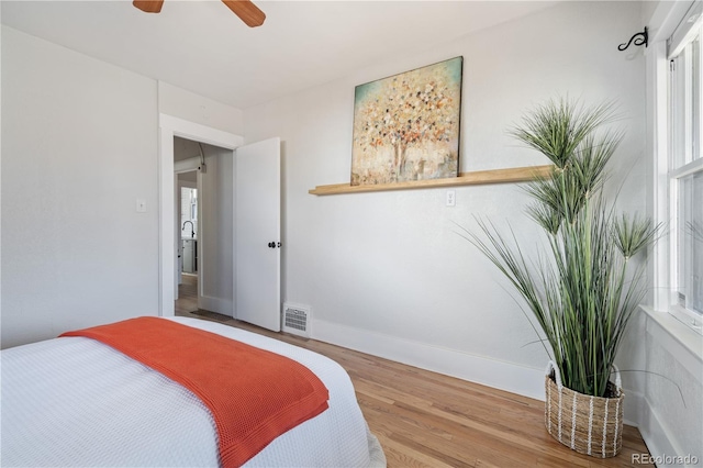 bedroom featuring ceiling fan and hardwood / wood-style floors