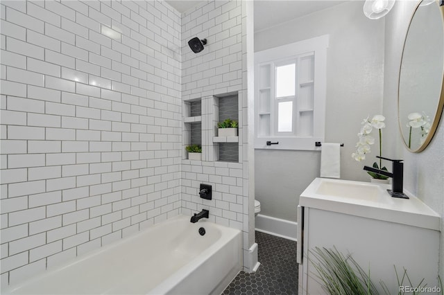 full bathroom featuring tile patterned floors, toilet, vanity, and tiled shower / bath