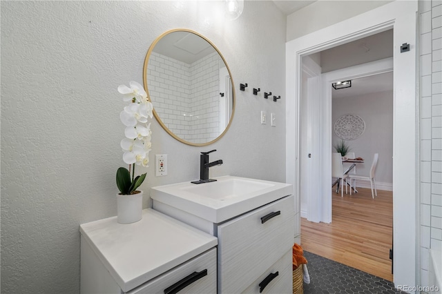 bathroom featuring hardwood / wood-style floors and vanity