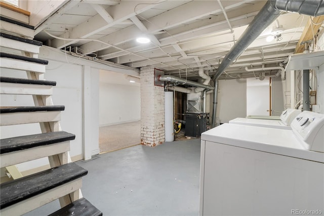 basement with washer and dryer and water heater