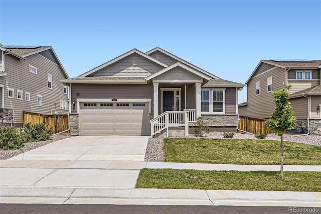 515 176th Ave, Broomfield, CO 80023 - craftsman-style house with stone siding, driveway, and a garage
