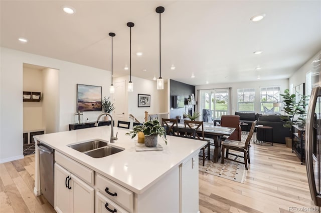515 176th Ave, Broomfield, CO 80023 - kitchen featuring a sink, light wood finished floors, open floor plan, light countertops, and recessed lighting