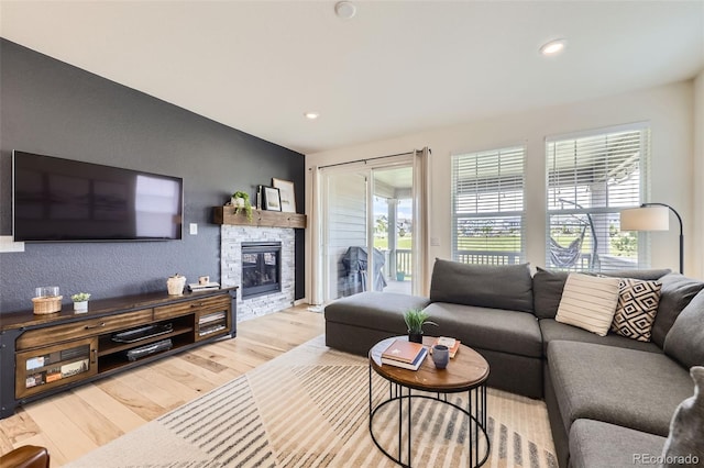 515 176th Ave, Broomfield, CO 80023 - living area with wood finished floors, a stone fireplace, and recessed lighting