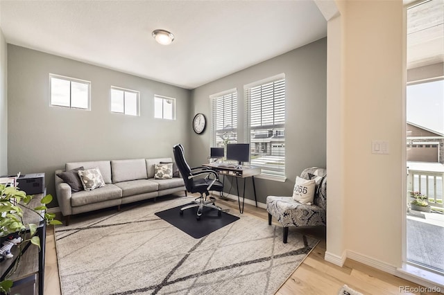 515 176th Ave, Broomfield, CO 80023 - office with wood finished floors, baseboards, and arched walkways