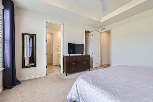 515 176th Ave, Broomfield, CO 80023 - bedroom with light colored carpet, baseboards, and connected bathroom