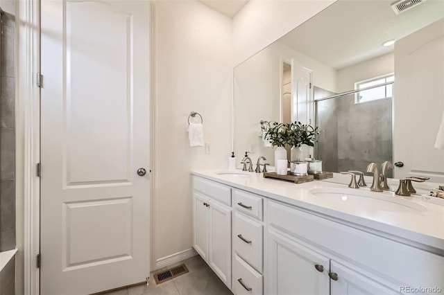 515 176th Ave, Broomfield, CO 80023 - bathroom with double vanity, a shower stall, and tile patterned floors