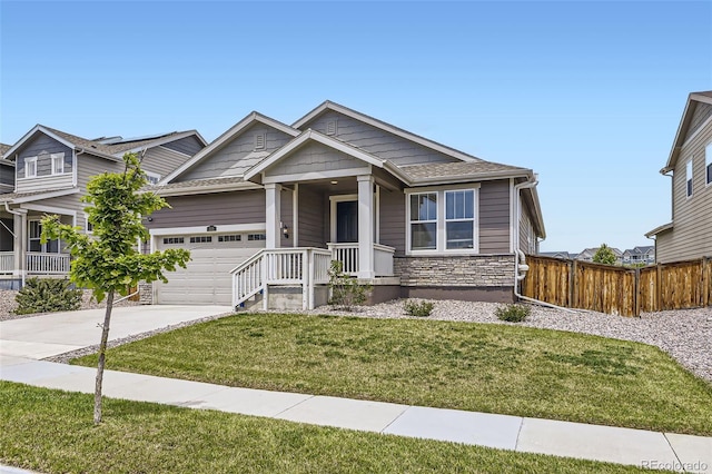 515 176th Ave, Broomfield, CO 80023 - view of front facade with concrete driveway, a garage, and stone siding