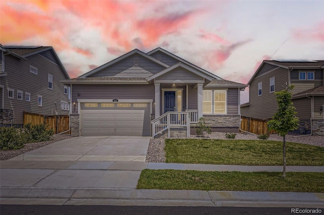 515 176th Ave, Broomfield, CO 80023 - craftsman house featuring a garage, driveway, and stone siding