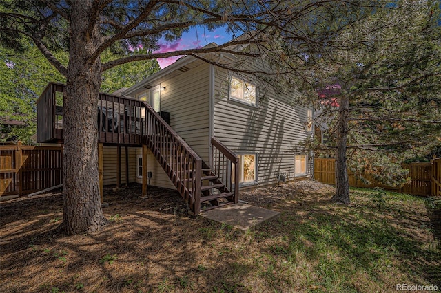 16724 E Hialeah Ave, Centennial, CO 80015 - back of property at dusk with stairway and a wooden deck